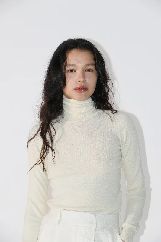 Roll Neck. Cream