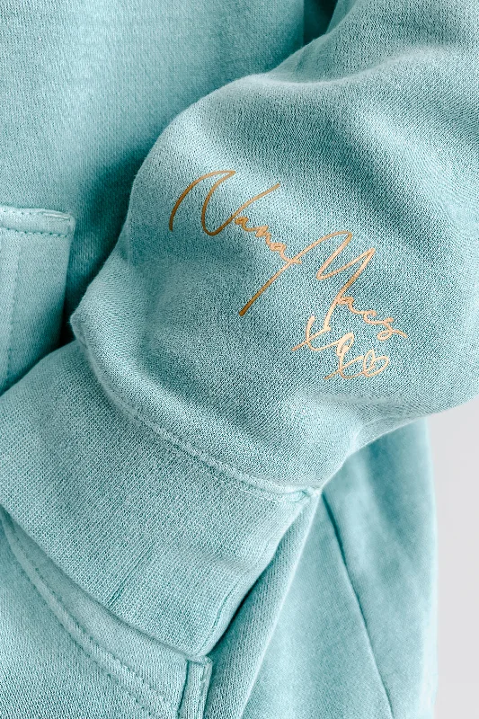 ""NanaMacs XOXO"" Vintage Wash Graphic Hoodie (Mint/Gold Text-Sleeve) - Print On Demand